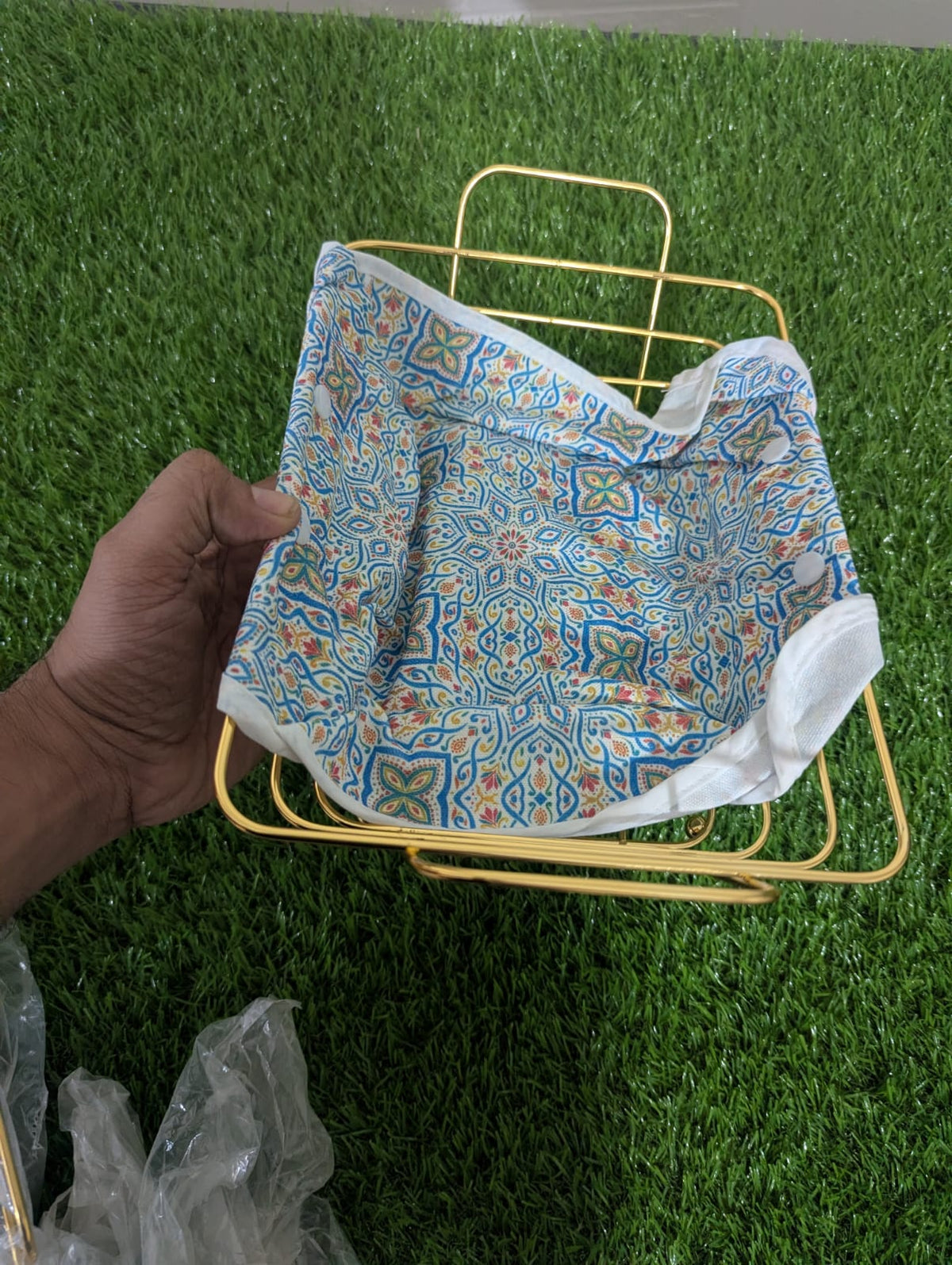 Close-up of patterned removable bread basket liner