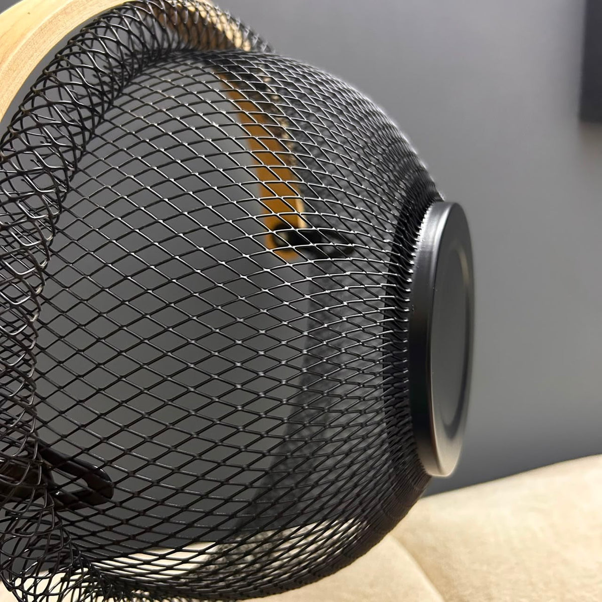 Close-up of fine metal mesh weave and bottom base