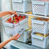Handled transparent fruit storage box with perforated inner drainage basket