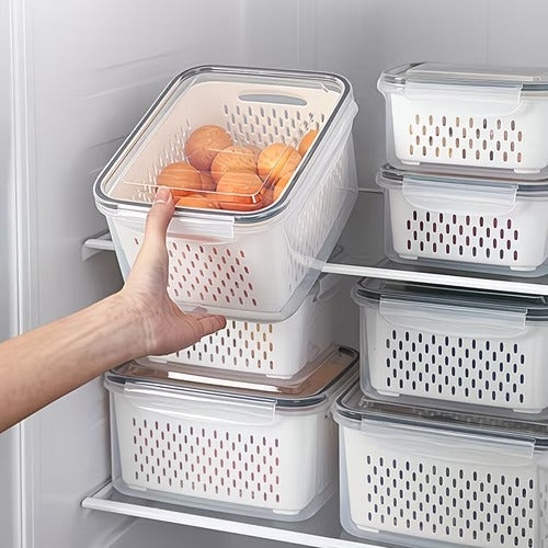 Stacked clear refrigerator produce storage containers with perforated inner baskets